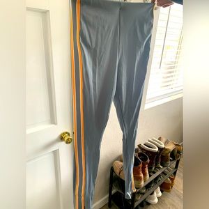 Fabletics grey with yellow stripes work out pants. Brand new never worn! Size M